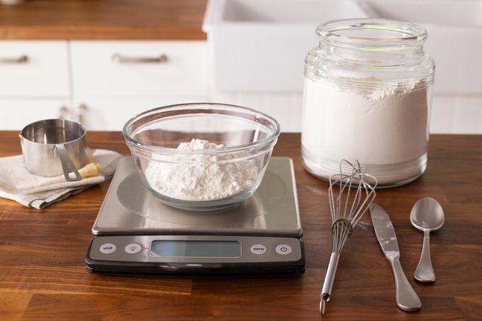 Bowl with flour on a small scale