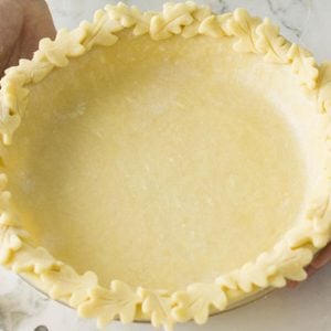 Method for how to decorate pie crust. Image of leaf crust trim.