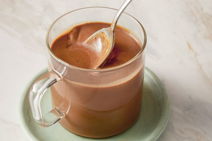 Pour reserved 2 tablespoons mint syrup, brewed espresso and chocolate milk into a coffee mug and stir to combine