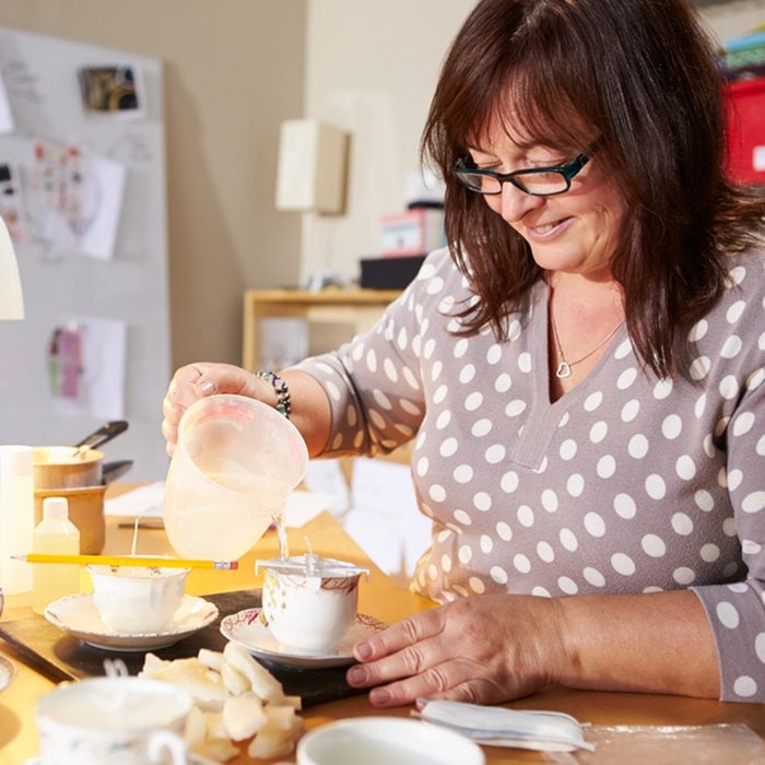 Mature Woman Making Candles At Home